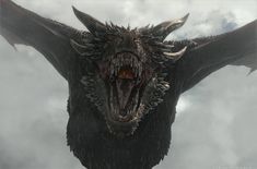 a large dragon with its mouth open in the sky