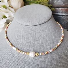 Thank you for visiting ChicBeadsUS shop! 🤍ABOUT🤍 I created this beautiful beaded pearl necklace inspired by beauty of freshwater pearls.  Rose gold and white, elegant design is perfect for highlighting your personal style, layering your necklaces or wearing as a single piece. Pearls are the ultimate symbol for wisdom.  Pearls also symbolize purity, as well as integrity and loyalty. This beaded choker is a great gift idea for any occasion such as birthdays, Valentine's day, anniversary and other holidays.  🤍MATERIALS 🤍 I use glass seed beads, gold plated findings(clasp, jump rings, chain extender) and large freshwater pearl. 🤍SIZE🤍 The length of the necklace is approximately 15 inches plus 1.5 inches gold plated chain extender. Do you want to be trendy?  Wear ChicBeadsUS🎀 Pink Pearl Jewelry With Tiny Beads, Dainty Pearl Choker With Round Beads, Adjustable Rose Gold Necklace With Round Beads, Adjustable Rose Gold Beaded Necklace For Gift, Rose Gold Beaded Pearl Necklaces, Rose Gold Pearl Necklace With Round Beads For Gift, Rose Gold Pearl Necklace With Round Beads, Rose Gold Single Strand Pearl Necklace, Adjustable Rose Gold Pearl Necklace