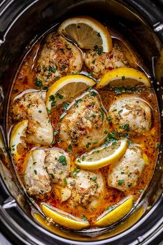 chicken with lemons and herbs in a slow cooker