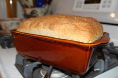 a loaf of bread sitting on top of a stove