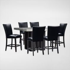 a group of black chairs sitting around a table with a marble top and backrests