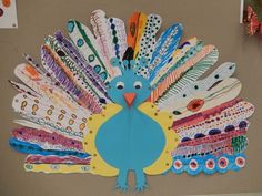 a paper turkey with lots of different colored feathers