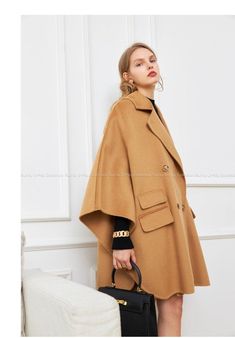 Elegant Beige Wool Coat Solid Color, Elegant Beige Wool Coat, Solid Cape Outerwear For Work, Beige Cape For Winter Workwear, Fall Wool Cape Coat For Work, Beige Cape For Fall Workwear, Chic Solid Color Wool Coat For Office, Beige Long Sleeve Cape For Work, Elegant Oversized Pea Coat For Office