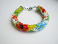 Beaded bracelet Flowers Seed bead jewelry Beadwork by IceBells Handmade Multicolor Flower Beaded Bracelets, Unique Beaded Flower Bracelets, Playful Flower-shaped Beaded Bracelets As Gifts, Unique Flower-shaped Beaded Bracelets, Multicolor Flower-shaped Beaded Bracelets For Summer, Multicolor Flower-shaped Beaded Bracelet, Knit Bracelet, Crochet Bracelet, Glass Beaded Bracelets