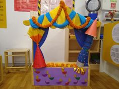 an inflatable clown costume is on display at a children's playroom