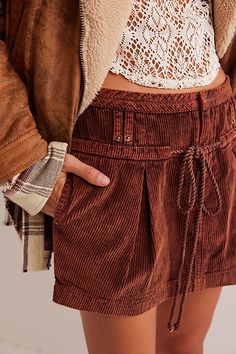 Cool in corduroy, this wear-everywhere skirt from our We The Free collection will be your go-to all season long. **Fit:** Low-rise, relaxed fit **Features:** Zip fly with hook-and-bar closure, soft corduroy fabrication, dropped drawcord closure, side pockets, pleating for added shape **Why We ❤ It:** Bold with tall boots or off-duty with sneakers, this style has endless ways to wear. | We The Free Silver Springs Cord Mini Skirt at Free People in Brown, Size: 26 Cord Mini Skirt, Mini Skirt Style, Silver Springs, Chocolate Truffle, Denim Dresses, Tall Boots, Clothes Gift, Off Duty, Skirt Fashion