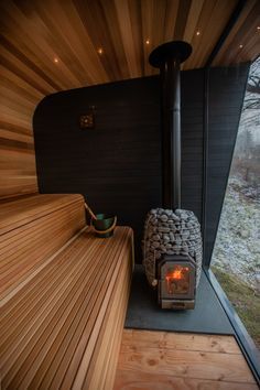 a wood burning stove inside of a wooden house