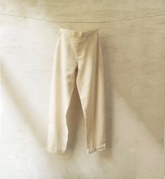 m o d e l  HUMA women's pants in handwoven handspun organic cotton. light, comfortable and versatile  - elastic at back of waist  - side pockets  f a b r i c kala cotton: handspun and handwoven indigenous Indian organic cotton  kala cotton n a t u r a l  d y e s  c o l o u r  - natural white (kora) - indigo s i z e s length all sizes 37,5'' which can be extended 2'' through letting down the hem XXS waist    26'' hip       44'' XS waist    28'' hip       46'' S waist    30'' hip        48'' M wai Flax Cotton Straight Pants, Ankle-length Flax Cotton Pants, Cotton Tapered Leg Bottoms In Flax Color, Tapered Leg Cotton Bottoms In Flax Color, Flax Colored Tapered Leg Cotton Bottoms, Traditional Linen Pants For Summer, Traditional Linen Summer Pants, Traditional Summer Linen Pants, Straight Leg Cotton Pants In Flax Color