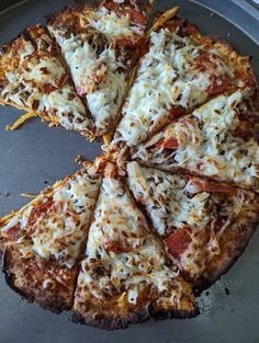 the pizza is cut into eight pieces and ready to be served on the table for consumption