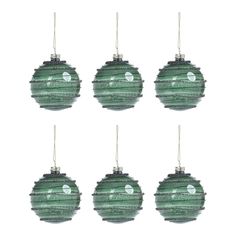 six green glass ornaments hanging from strings