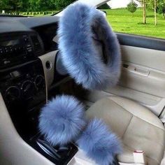 the interior of a car with blue fur on it