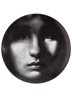 a black and white photo of a woman's face on a plate with the words,