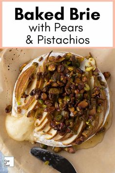 baked brie with pears and pistachios in a white bowl next to a knife