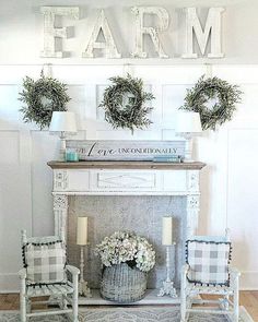 a living room with two chairs and a fire place in front of a sign that says farm