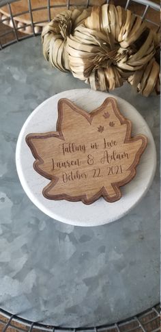 a couple of wooden signs sitting on top of a table