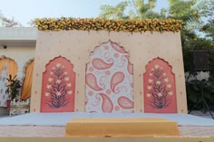 an elaborately decorated stage set up for a wedding