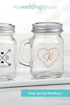 two mason jars sitting on top of a laptop computer with the words, my wedding favors