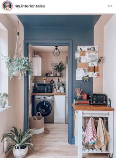 a laundry room with a washer and dryer in the corner next to it