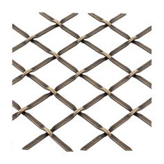 a close up view of a metal mesh fence with wooden sticks sticking out of it