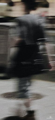 a blurry photo of a person riding a skateboard