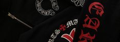 a black jacket with red and white designs on it