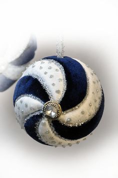 a blue and white ornament hanging from a string