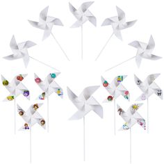 a group of pinwheels with stickers in the shape of animals on them