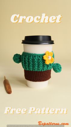 a coffee cup with a knitted cactus on it