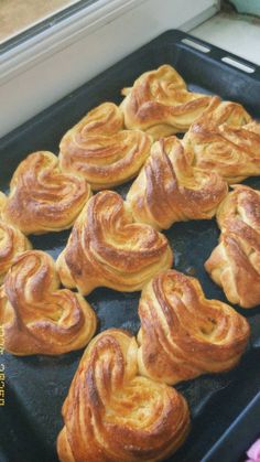 there are many pastries on the baking sheet