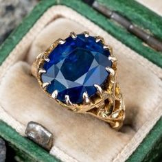 This stunning ring is centered with an oval mixed cut sapphire, weighing 6.22 carats in a multi-prong setting. The lower gallery and shoulders are accented with a pierced design. The ring measures 12.9mm at the top, rises 6.1mm above the finger, tapering to 2.6mm wide and 1.0mm thick at the base of the shank. The ring is currently a size 3.5 and we offer complimentary sizing to fit. Luxury Gold Sapphire Ring, Timeless Luxury Yellow Gold Sapphire Ring, Luxury Everyday Yellow Gold Sapphire Ring, Engagement Rings Blue, Oval Sapphire Engagement Ring, Green Montana, Rings Blue, Sapphire Engagement Rings, Ruby Diamond Rings