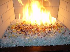 Paint, remove the doors, add burner, add fire glass, you get a very nice fire... Fireplace Glass Rocks, Fireplace Remodel Diy, Fire Crystals, Easy Fireplace, Fire Glass Fireplace, Fire Pit Glass, Fire Pit Essentials, Fireplace Glass, Large Fire Pit