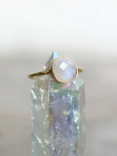 This exquisite aesthetic hand-hammered rainbow moonstone ring captures the essence of timeless elegance. Known for boosting intuition and accessing inner magic, the moonstone resonates with feminine energy, blending intuition, wisdom, and emotional well-being. This enchanting crystal elevates energy, aids in releasing what no longer serves you, and enhances manifesting practices. With strong connections to the higher chakras, it opens communication, creativity, insight, and spiritual connection. Crafted from 925 sterling silver and plated with 18k gold, the hypoallergenic ring ensures lasting beauty. Embrace the magic of this authentic gemstone, perfect for adding a touch of ethereal charm to any ensemble. Higher Chakras, Angel Aura, Rainbow Moonstone Ring, Spiritual Connection, The Goddess, Moonstone Ring, Feminine Energy, Emotional Wellness, Rainbow Moonstone