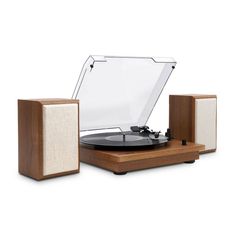 an old record player and speakers on a white background