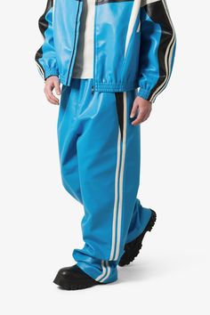 the Icon Oversized PU Track Pants is constructed from a vegan leather fabric, contrast striping details at the outseam, elasticized-self ribbing at the waist, and finished in an oversized, baggy fit. details baggy fit 100% polyester elasticized-self ribbing model is 6’1, 160 lbs and wears a size medium Fit Details, Baggy Fits, Leather Fabric, Track Pants, Vegan Leather, Blue Black, Track, Size Medium, Pants