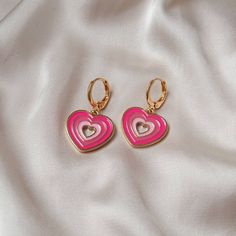 Don't miss out on these beautiful gold plated and pink retro heart drop earrings. They work with a large variety of looks and add a bit of sparkle to your outfit. Dimensions: Drop Length - 3cm Width - 2.8cm MORE jewellery pieces available on our shop! Any questions please message we are happy to help. Free postage in UK Thank you for shopping with us Heather&Bumble 📪Follow us at: Instagram: heatherandbumble Twitter: Heather_Bumble Pintrest: Heather & Bumble Pink & Gold Retro Heart Drop Earrings -  70's Style Earrings, Vintage Style, Hanging Jewellery,Accessories,Pink Jewellery,Gold Earrings Pink Heart Charm Hoop Earrings For Valentine's Day, Pink Hoop Earrings With Heart Charm For Valentine's Day, Nickel Free Pink Heart Pendant Jewelry, Vintage Heart Charm Earrings For Valentine's Day, Retro Heart-shaped Jewelry Gift, Pink Nickel-free Heart Earrings For Valentine's Day, Vintage Drop Earrings For Valentine's Day, Pink Pierced Earrings As Gift, Pink Double Heart Jewelry With Matching Earrings