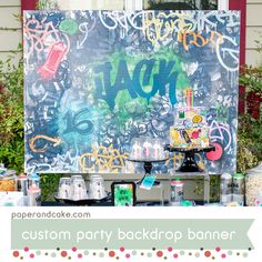 a birthday party backdrop with lots of graffiti on it