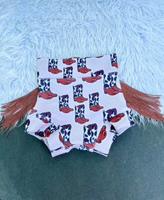 Such a fashionable Fringed Western Cowboy Boots Bummie Set. Cowboy or Cowgirl will get loads of glances in this sweet and sassy outfit. A great addition to your Little's wardrobe.  This listing is for a pair of baby bummies only. Should you want a bow on a nylon band just make note at checkout. We love custom orders so if you would like this in a skirued bummie, flare leg pants or something else just message me.                                                                                                   Turnaround time is 7-14 days but should you need your order sooner just message me and I know we can work it out. Please make note of the date needed at check out as to not overlook the date.                                                              Adult supervision is recommended Outfit Cowboy, Western Baby, Western Babies, Sassy Outfit, Baby Girl Outfit, Flare Leg Pants, Baby Outfit, Western Cowboy Boots, Diaper Cover