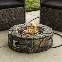 a fire pit sitting on top of a stone patio