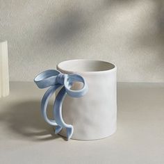 Pink Bow Mug - Lovesickdoe Blue Ceramic Modeling, Cool Pottery, Coquette Stuff, Pottery Coffee Mugs, Cool Mug, Clay Mug, Diy Pottery Painting, Diy Mugs, Pretty Mugs