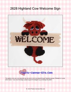 a cross stitch cow holding a welcome sign with the word welcome on it's side