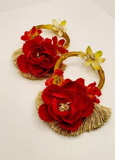 Beautiful handcrafted oversized rose floral & tassel earrings with gold finish bamboo hoops. Designed & Handcrafted by BOTENTA Size: 4"x4.5", Drop 5" Type: Wire hook Brand: Botenta Colors: Red, Gold Style: Womens's earrings Fabric: Bamboo, fabric flower, polyester tassel BOTENTA Brand Story BOTENTA is a sustainable brand created by a mother and daughter team, located in Midwest USA. These creative ladies' source local raw materials from vintage and post-consumer waste. Post-consumer good Bohemian Gold Flower Earrings Handmade, Gift Red Hoop Earrings With Latkans, Red Hoop Earrings With Latkans For Gift, Red Hoop Earrings With Latkans As A Gift, Earrings Fabric, Oversized Earrings, Fabric Flower, Sustainable Brand, Bamboo Fabric