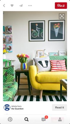 a living room filled with furniture and pictures on the wall