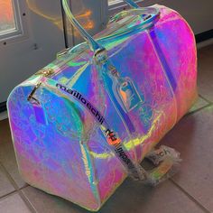 Mailloechii Holographic Iridescent Color Changing Duffel Bag. Full Size With Monogram All Over Embossed Pattern. Rare, And Hard To Find. Golden Accessories, Feet On Bottom Of Bag With Chain Detail. Brand New, Original Value Of $1,200. Only 1 Left In After-Stock For $375 Iridescent Keychain, Golden Accessories, Pink Duffle Bag, Holographic Iridescent, Holographic Bag, Louis Vuitton Travel, Iridescent Color, Embossed Pattern, Colorful Backpacks