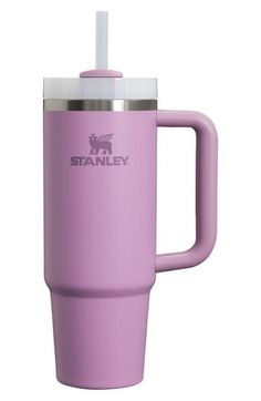 the stanley travel mug in lila is shown with a straw sticking out of it's lid