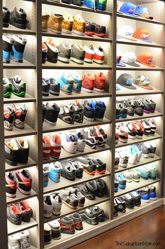 there are many pairs of shoes on the shelves