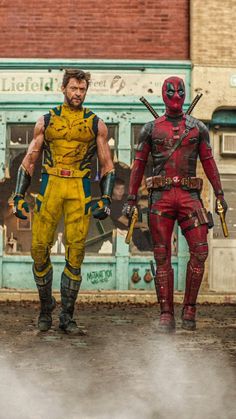 two deadpools standing in front of a building