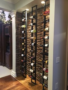 a wine rack in the corner of a room