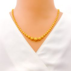 This exquisite 22k gold Lara necklace set, weighing 28.4 grams, features a radiant yellow gold finish and a striking striped design. The necklace measures 20 inches in length, with adjustable 0.6-inch links for a perfect fit. The set includes matching earrings, each 1.5 inches long with screw back posts and detachable hanging elements. Secured with a hook lock, this set is ideal for those who appreciate elegant and sophisticated jewelry, combining timeless beauty with a bold striped motif, makin Yellow 22k Gold Necklaces With Round Beads, Yellow 22k Gold Round Necklace, Hand-set Yellow Gold-plated Necklace, Formal Yellow 22k Gold Chain Necklace, Elegant Gold Plated Yellow Temple Necklace, 22k Yellow Gold Round Beads Necklace, Yellow 22k Gold Necklace With Round Beads, Elegant 22k Gold Yellow Temple Necklace, Elegant 22k Gold Yellow Chain Necklace