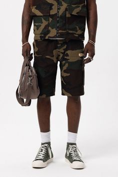 Off The System Camouflage Men's Shorts New season cargo pocket camouflage men's shorts. PRODUCT FEATURES -Front embroidery print -Adjustable waistband elastic -Cargo pockets -Regular fit -95% Cotton, 5% Lycra ABOUT US As Rexec Vision, we offer you street style online with our many years of industry experience. Why? Because, we wanted to make something bigger, unique, innovative, creative, permanent, and fascinating. We tried to gather our ambitions, ideas, skills at the same place. We wanted to Camouflage Cotton Cargo Shorts With Side Pockets, Camouflage Utility Shorts, Military Style Camouflage Cotton Cargo Shorts, Military Style Camouflage Shorts With Multiple Pockets, Military Style Camouflage Shorts For Streetwear, Military Camouflage Shorts With Multiple Pockets, Military Camouflage Shorts For Streetwear, Utility Camouflage Cotton Cargo Shorts, Camouflage Cotton Cargo Shorts With Pockets