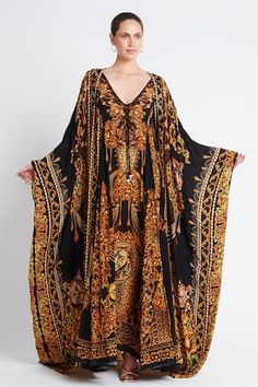 Black and gold maxi dress with leopard print and crystal embellishments in viscose silk base. - Aza Fashions Traditional Long Luxury Kaftan, Luxury Traditional Long Kaftan, Luxury Festive Kaftan For Celebration, Luxury Kaftan With Resham Embroidery And Kimono Sleeves, Luxury Kaftan With Printed Motifs, Luxury Elegant Festive Kaftan, Luxury Long Kaftan For Festivals, Luxury Hand Embellished Traditional Kaftan, Luxury Bohemian Kaftan With Dabka Details